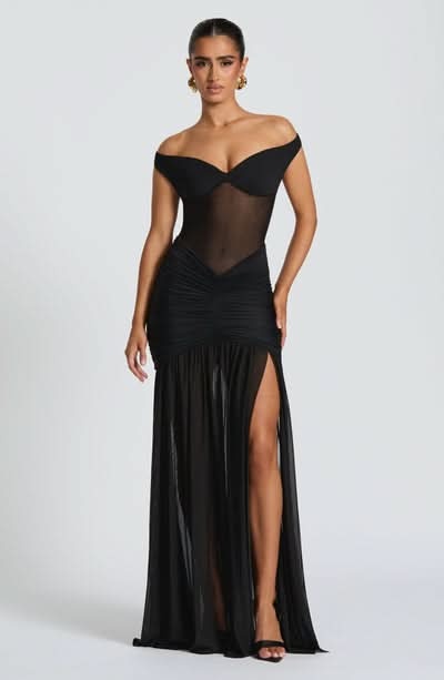 Black off-shoulder ruched maxi dress with high leg slit and sheer bodice