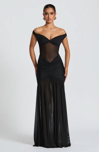 Black ruched maxi dress front view with off-shoulder neckline and slit