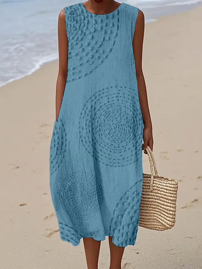 Teal textured maxi dress with circular pattern and functional side pockets