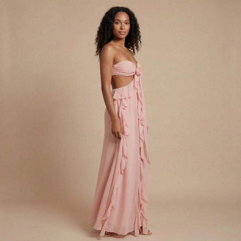 Blush pink strapless maxi dress with cascading ruffles and waist cutout detail for women