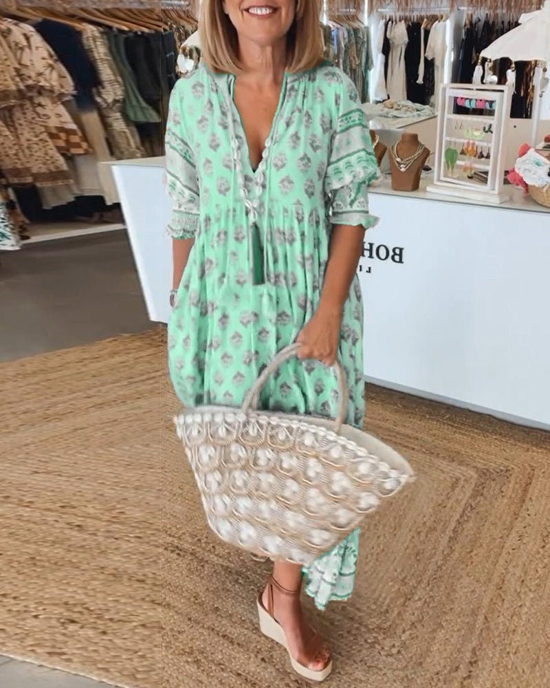 Mint green floral tiered maxi dress with decorative lace sleeves and hem