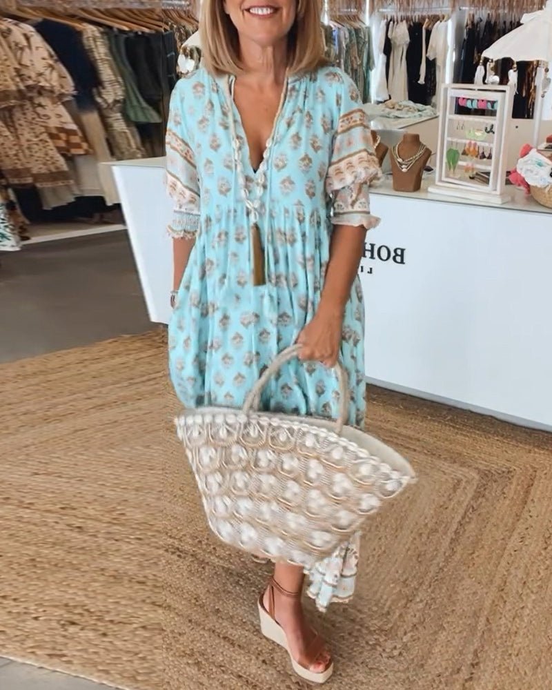 Light blue floral tiered maxi dress with lace trim and three-quarter sleeves