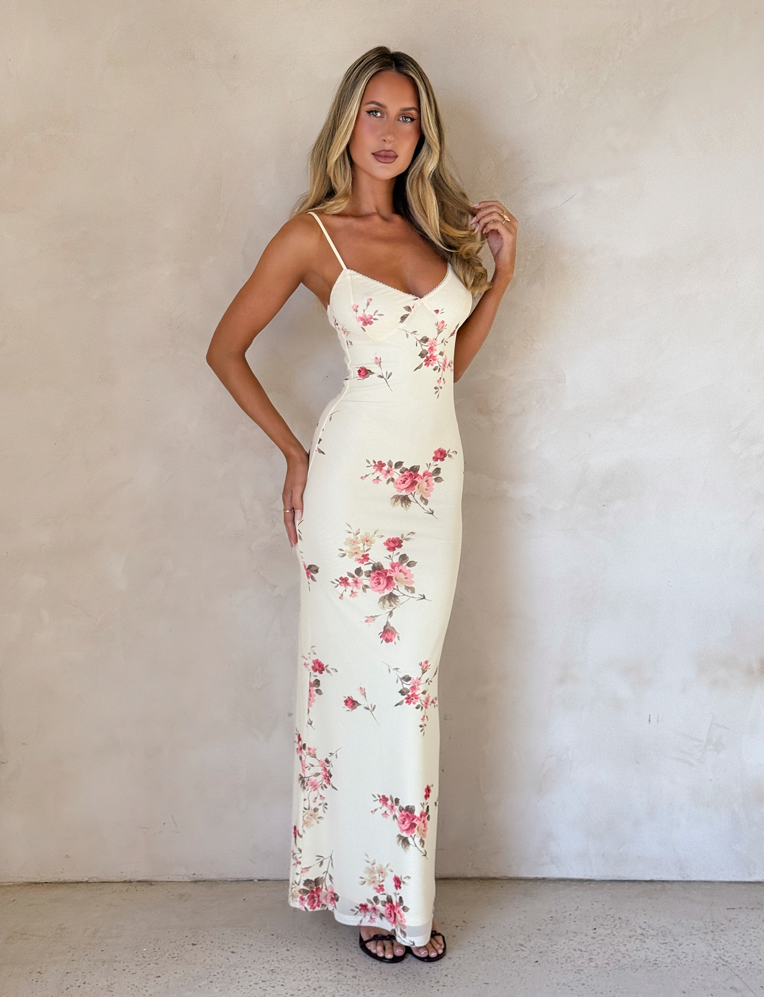 Front full-length view of cream floral maxi dress with rose pattern