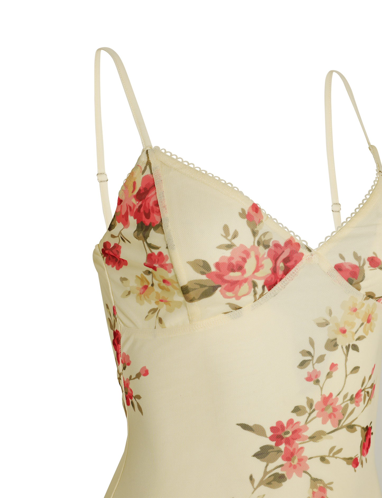 Close-up of spaghetti strap and sweetheart neckline with pink rose print