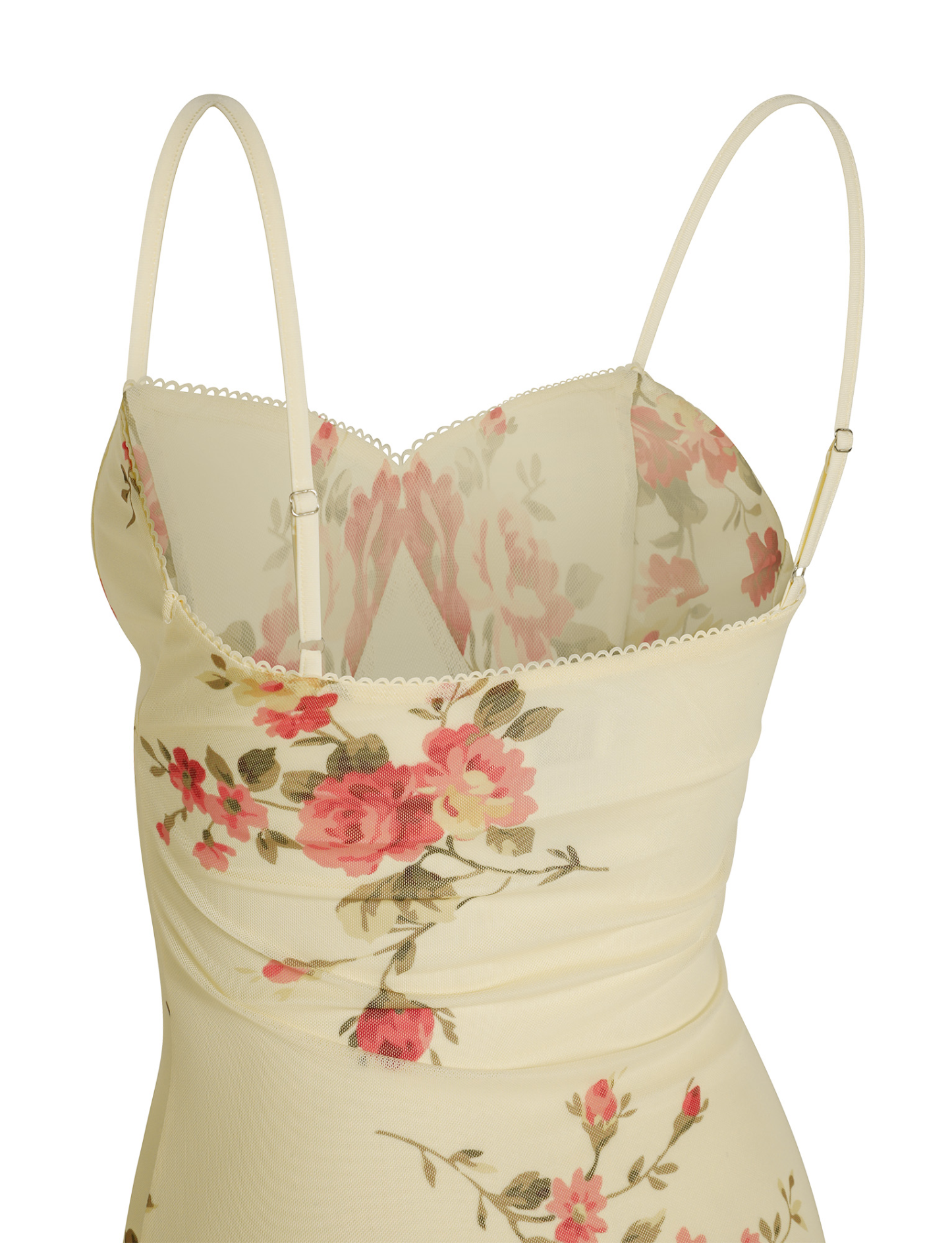 Detail of fitted bodice with ruched waist and floral embroidery