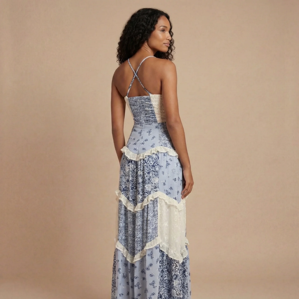 Back view of blue floral maxi dress with adjustable crossed straps