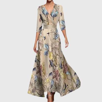 Cream wrap maxi dress with blue yellow and burgundy botanical leaf print and three-quarter sleeves