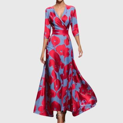 Red floral wrap maxi dress with three-quarter sleeves and cinched waist on blue background