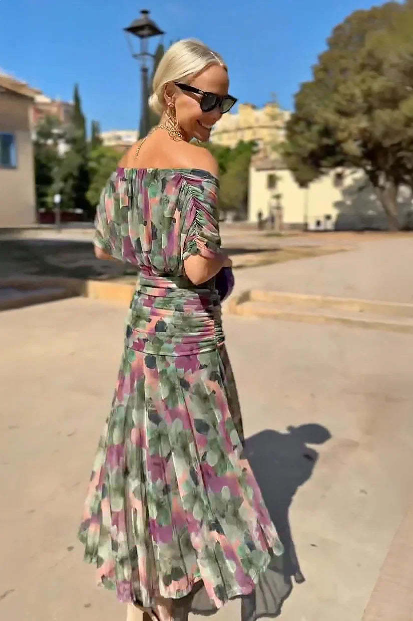 Off-shoulder draped maxi dress in multicolor floral print with ruched waist