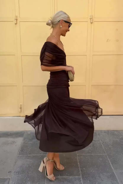 Burgundy draped maxi dress side profile showing ruched waist and flowing skirt