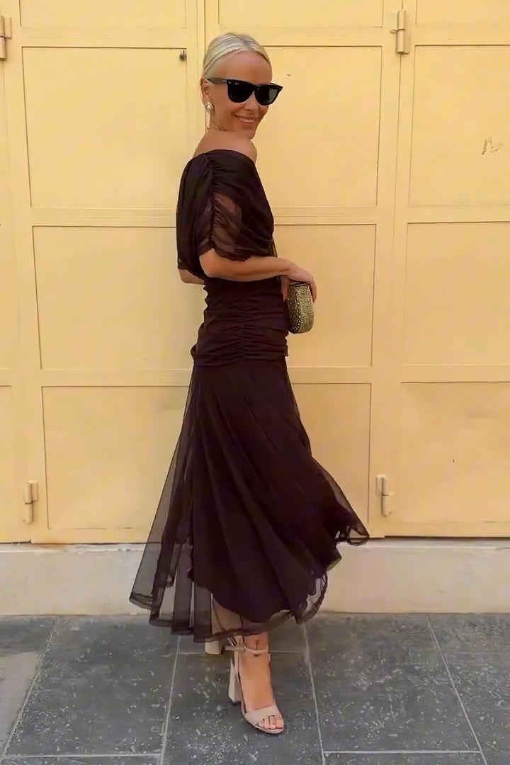 Burgundy draped maxi dress back view showing flowing layered skirt