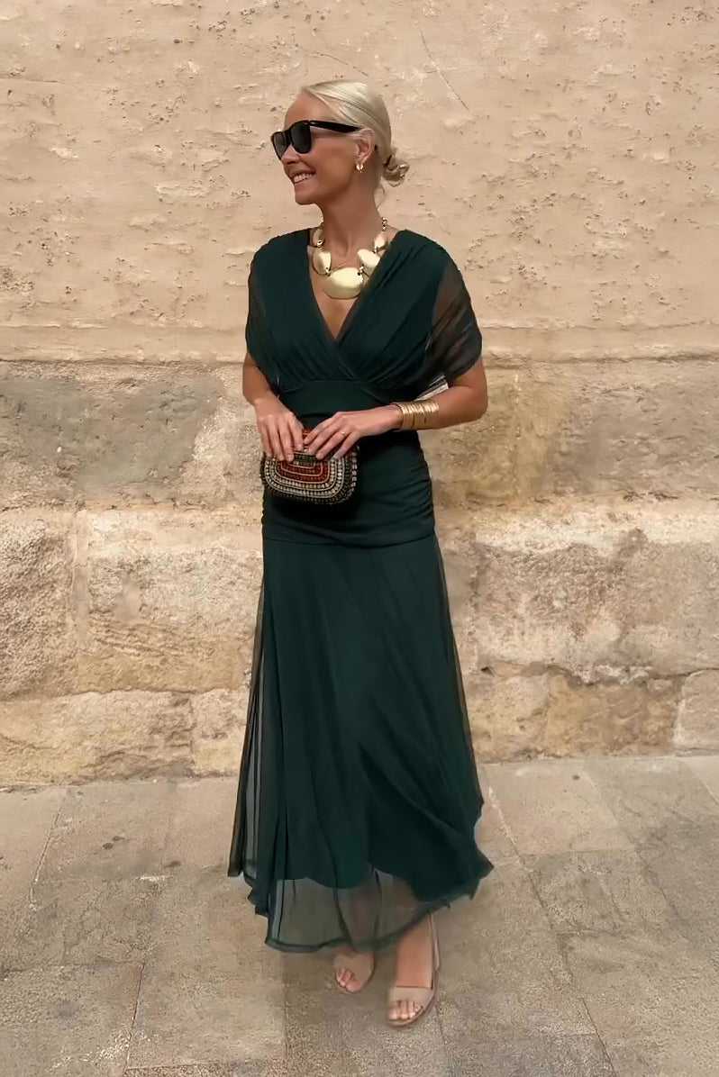 Forest green draped maxi dress with short sleeves and flowing skirt
