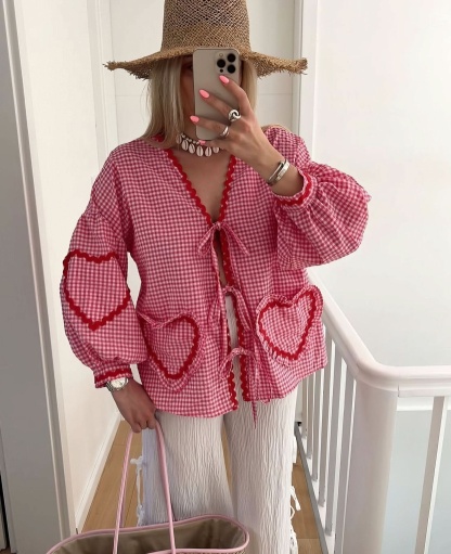 pink gingham blouse with scalloped heart pockets and puffed sleeves
