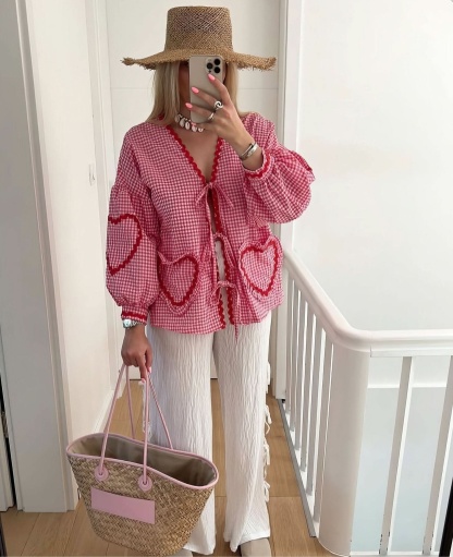 pink checkered top with ruffle heart pockets and tie-front closure detail