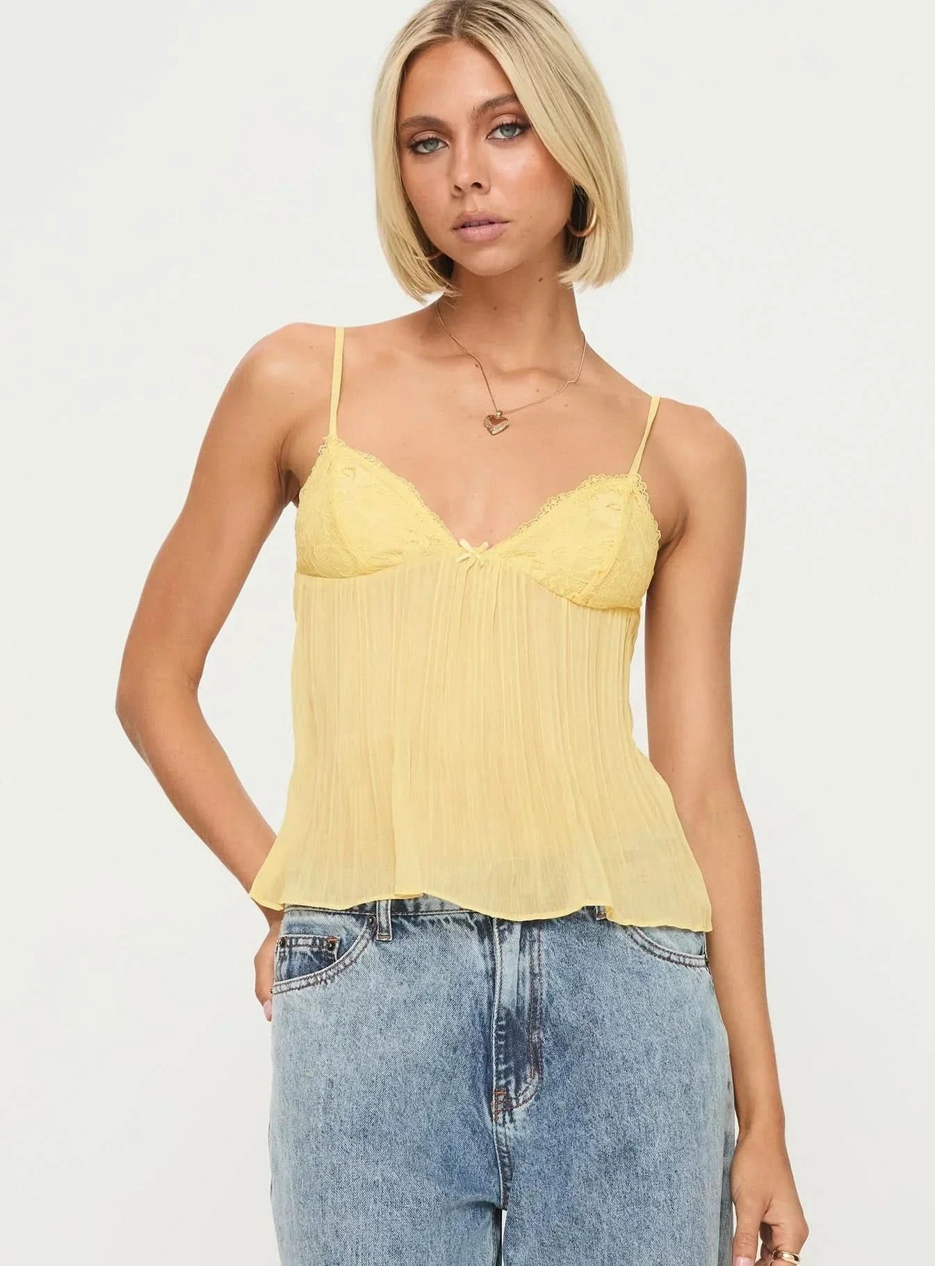 Front view of pale yellow lace cami with sweetheart neckline