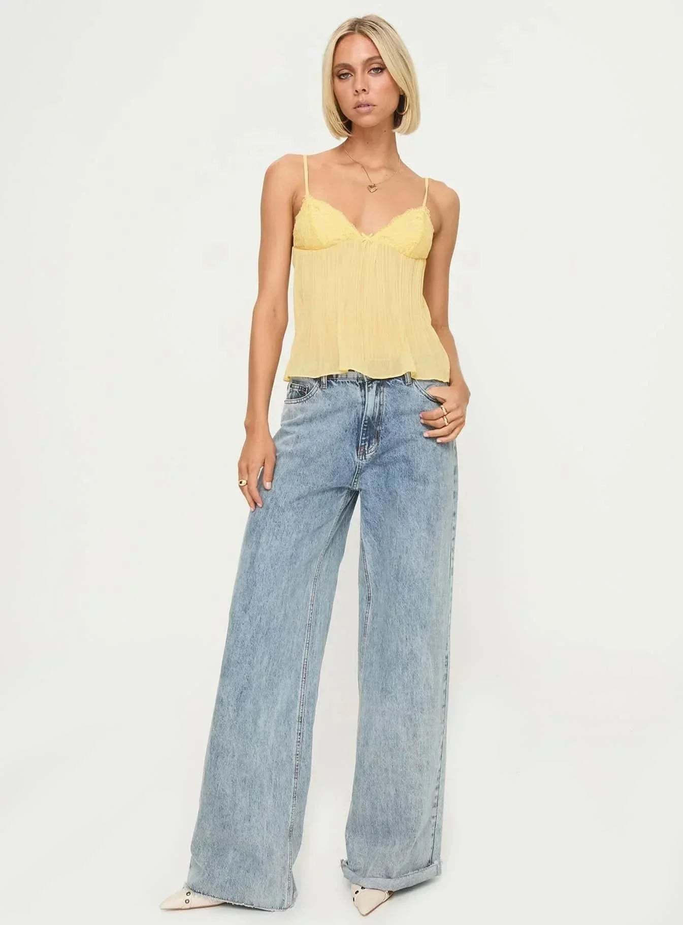 Full-length view of yellow lace cami top with light blue jeans