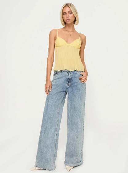 Full-length view of yellow lace cami top with light blue jeans
