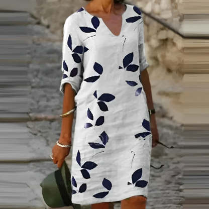Cream leaf print mini shift dress with navy leaves and V-neckline