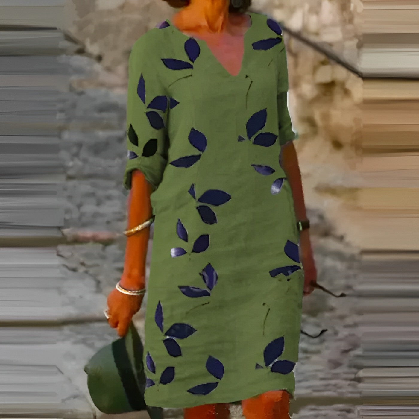Green leaf print mini dress with relaxed shift fit and short sleeves