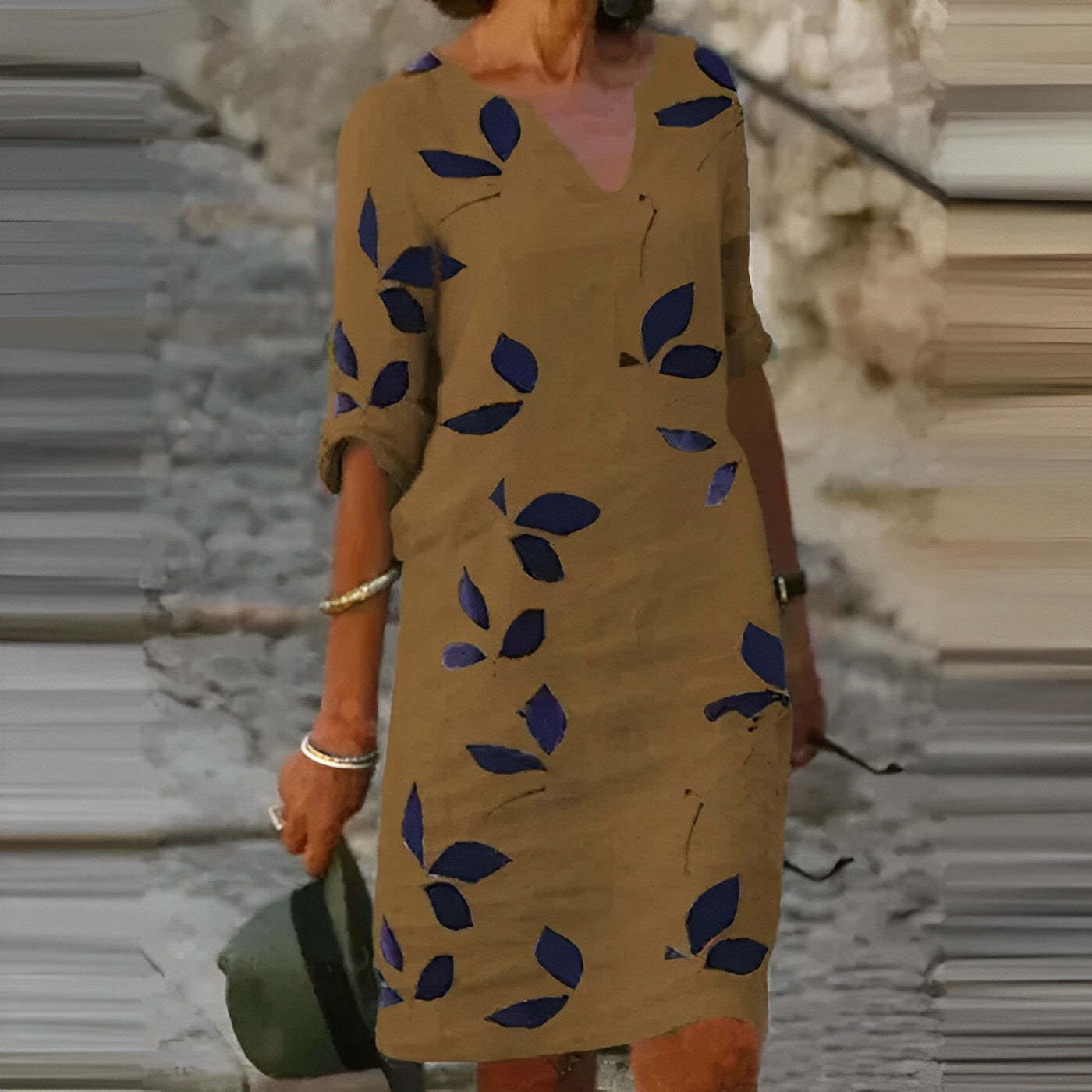 Mustard leaf print mini dress with navy leaf pattern and V-neck