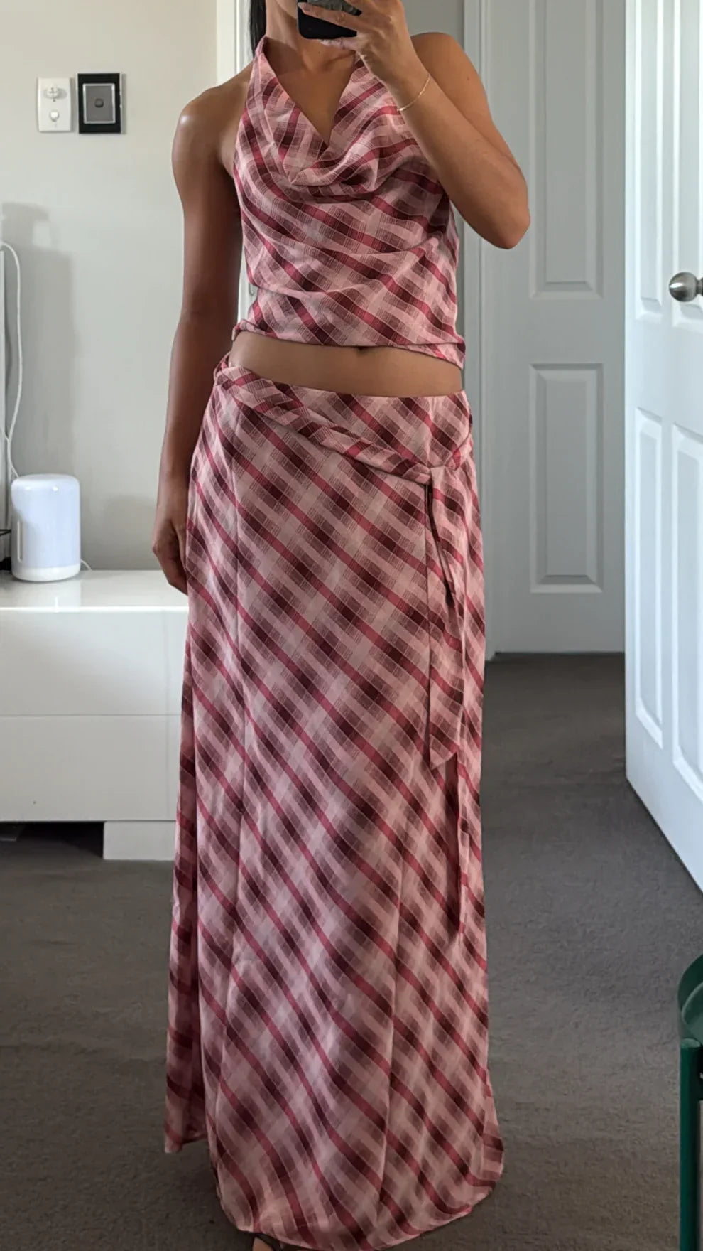 Two-piece plaid set showing separated crop top and high-waisted maxi skirt