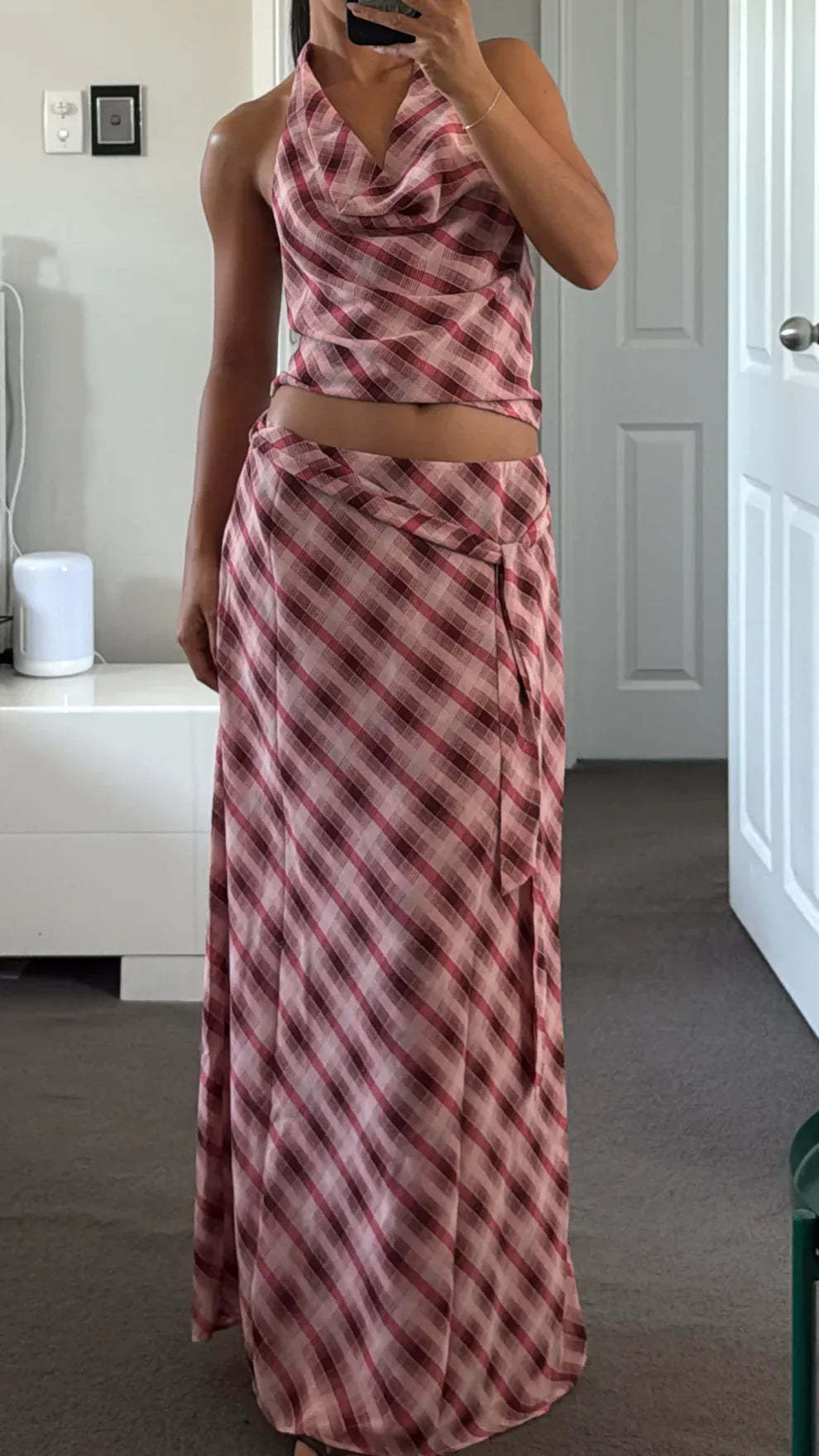 Two-piece plaid set showing separated crop top and high-waisted maxi skirt