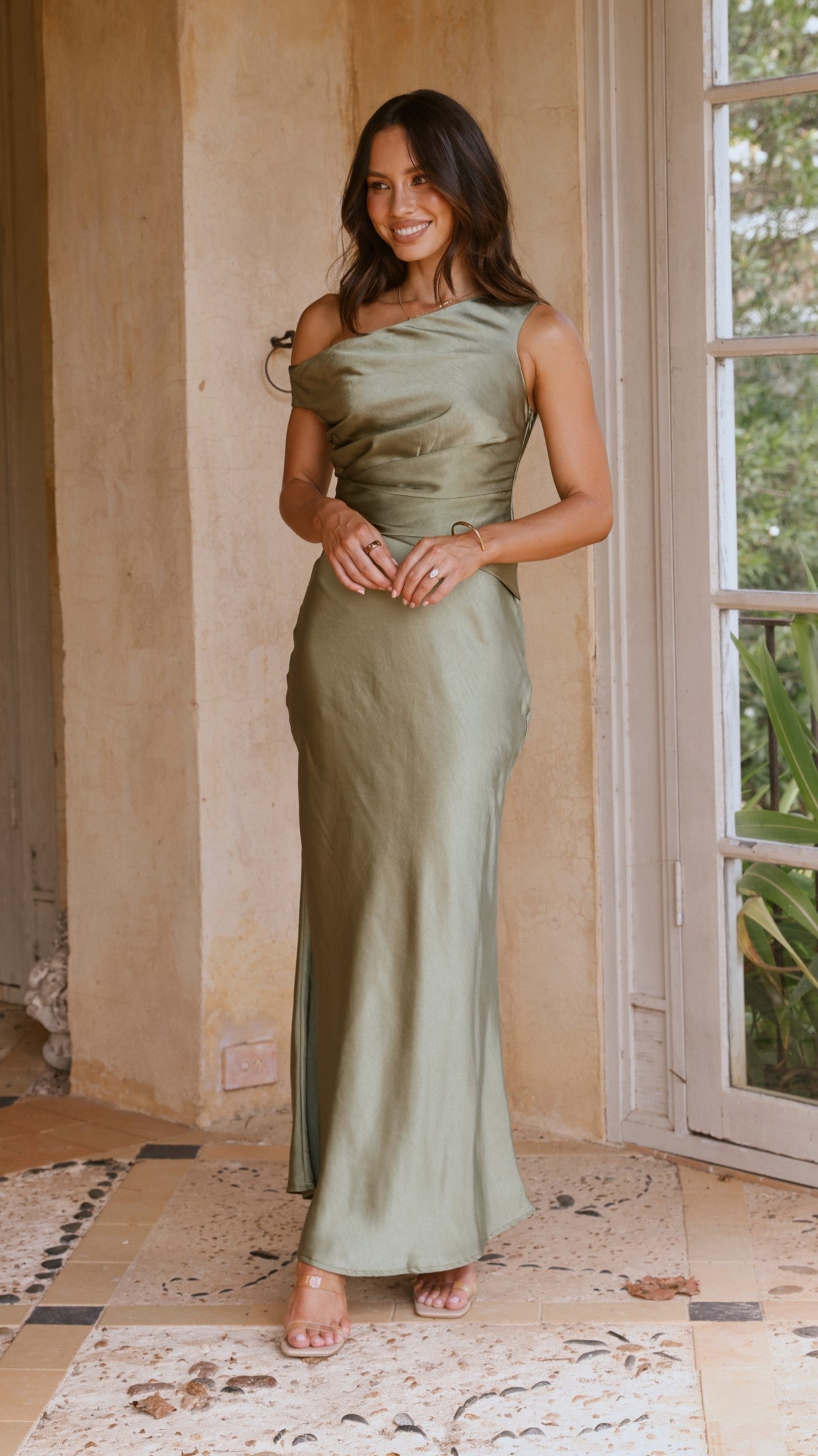 Sage maxi dress front view showing ruched waist and flowing skirt