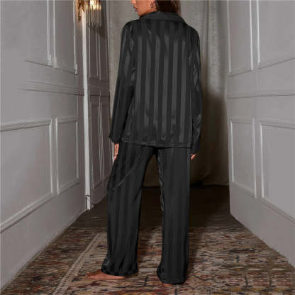 Back view of charcoal striped satin pajama shirt showing vertical stripe pattern