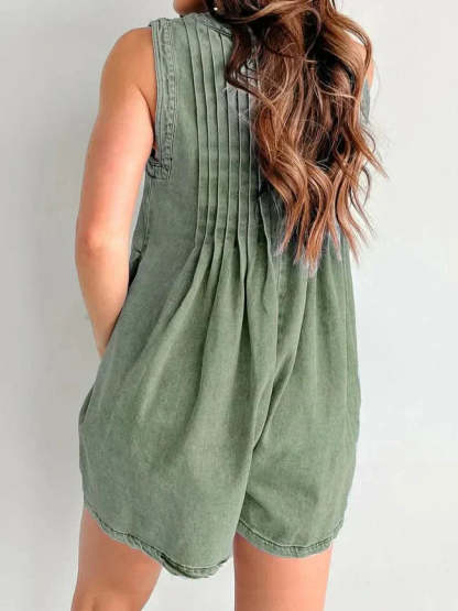 Sage green romper back view displaying pleated bodice and relaxed silhouette