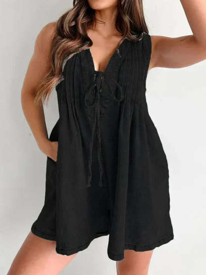 Black lace-up mini romper with V-neck and pleated bodice detail