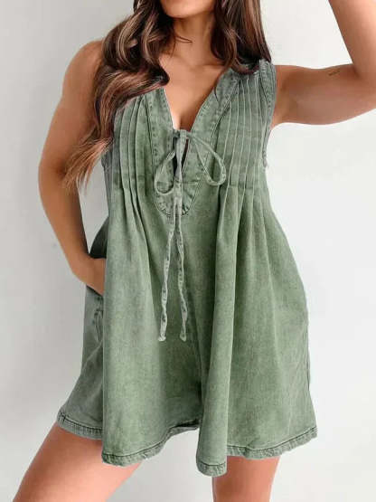 Sage green lace-up mini romper with pleated front and V-neckline