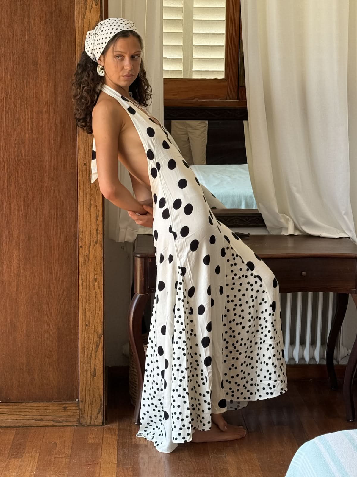 White polka dot halter maxi dress with gradient dot pattern detail