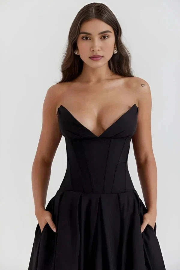 Black strapless corset dress with sweetheart neckline and pocket details