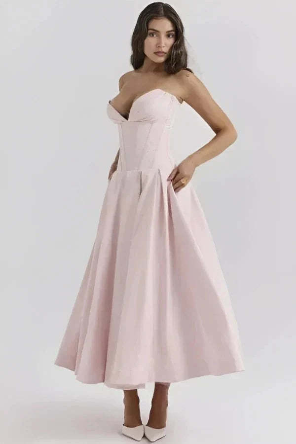 Blush pink strapless corset midi dress with sweetheart neckline and full skirt