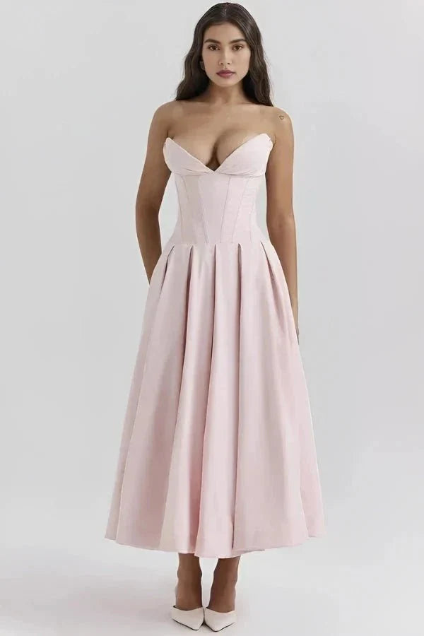 Light pink corset midi dress with structured bodice, sweetheart neckline and pleated skirt