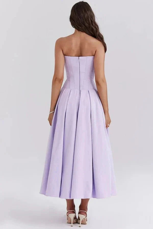 Back view of lavender strapless corset dress with structured bodice and full skirt