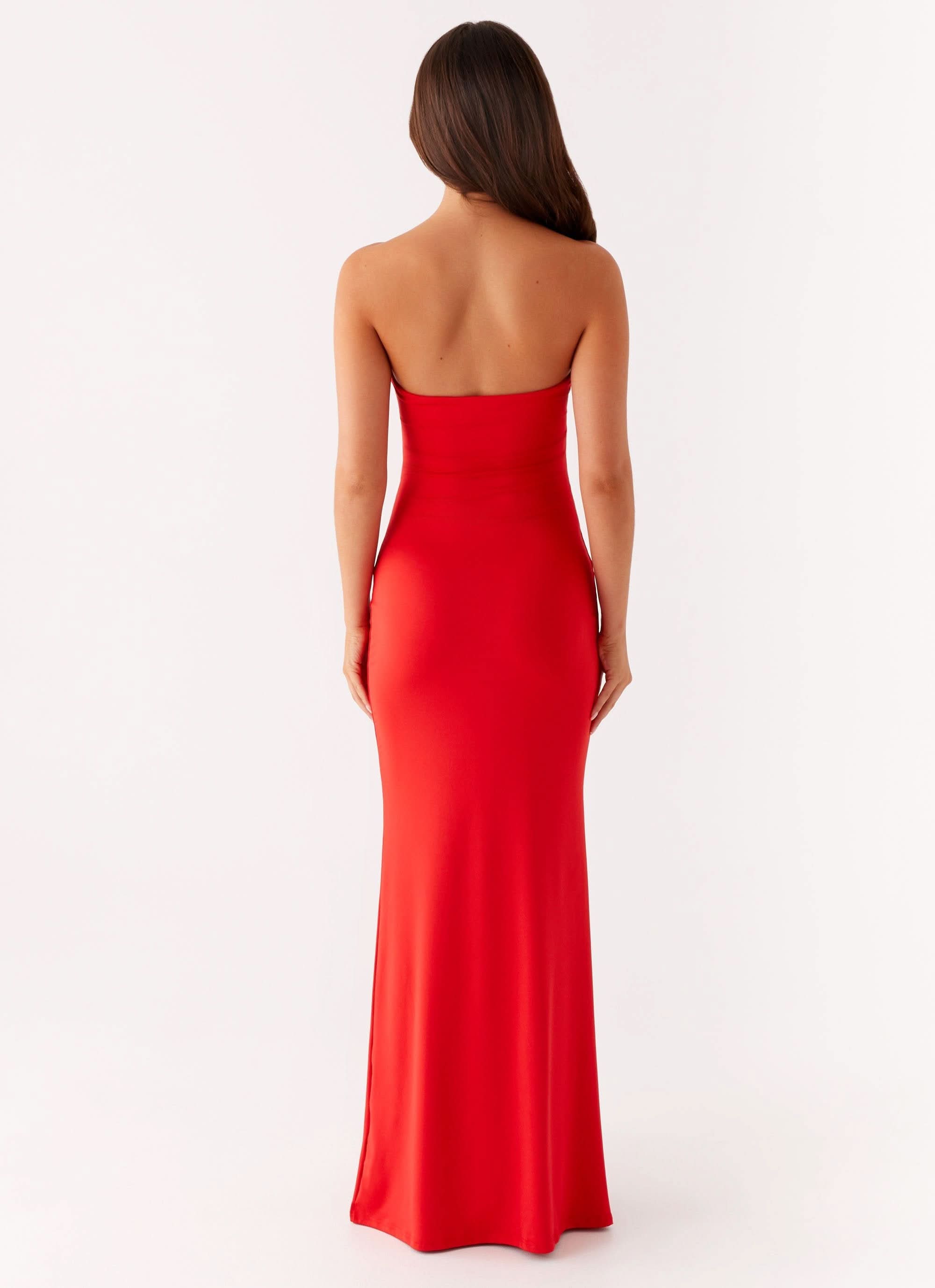 Back view of red strapless maxi dress with smooth fitted silhouette