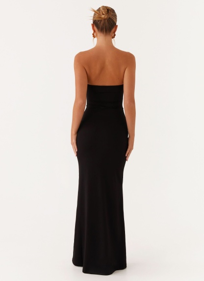 Back view of black strapless maxi dress with sleek fitted design