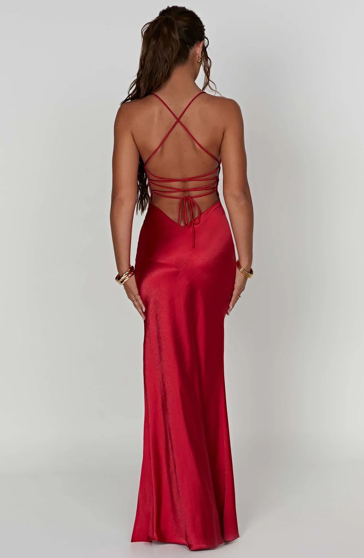 Back view of red satin maxi dress with crisscross straps