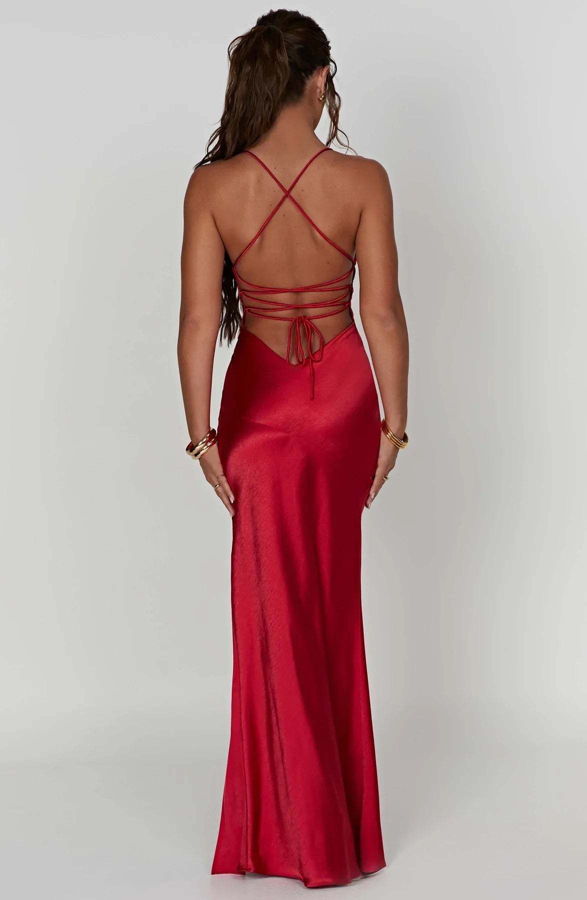 Back view of red satin maxi dress with crisscross straps