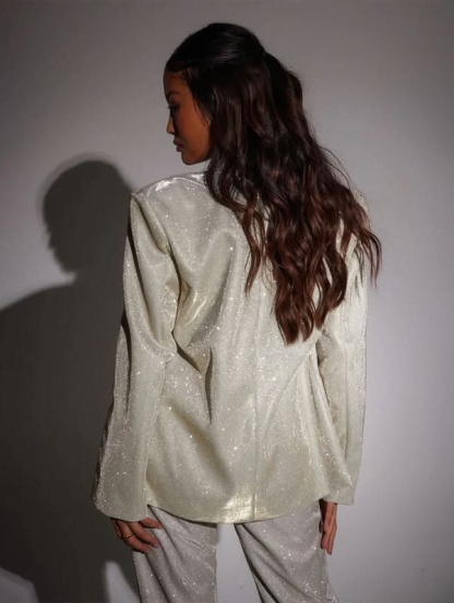 Cream glitter blazer back view showing sequin texture and drape