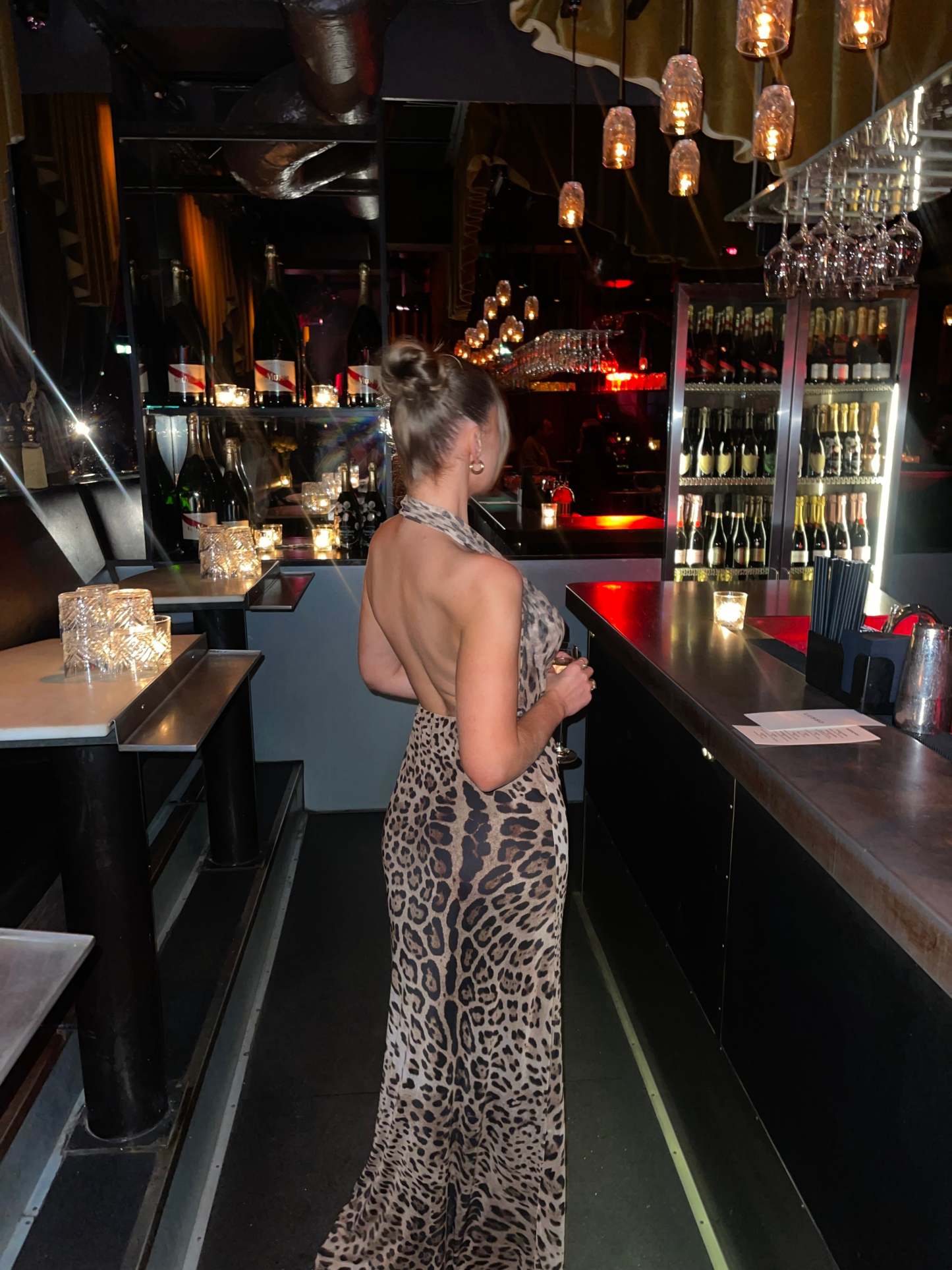 Leopard print maxi dress with open back and halter neckline side view