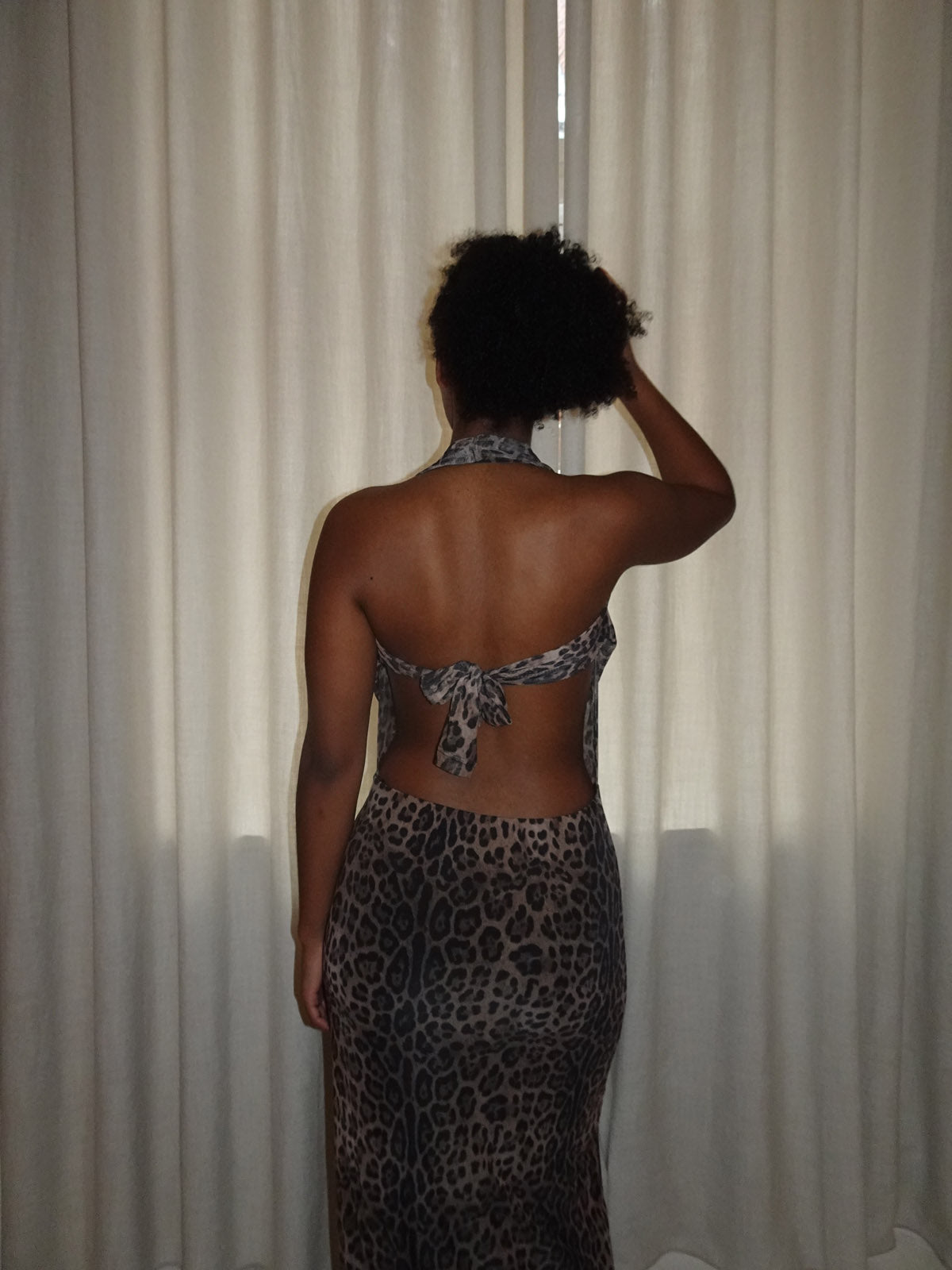 Tan leopard maxi dress with plunging V-neck and backless design