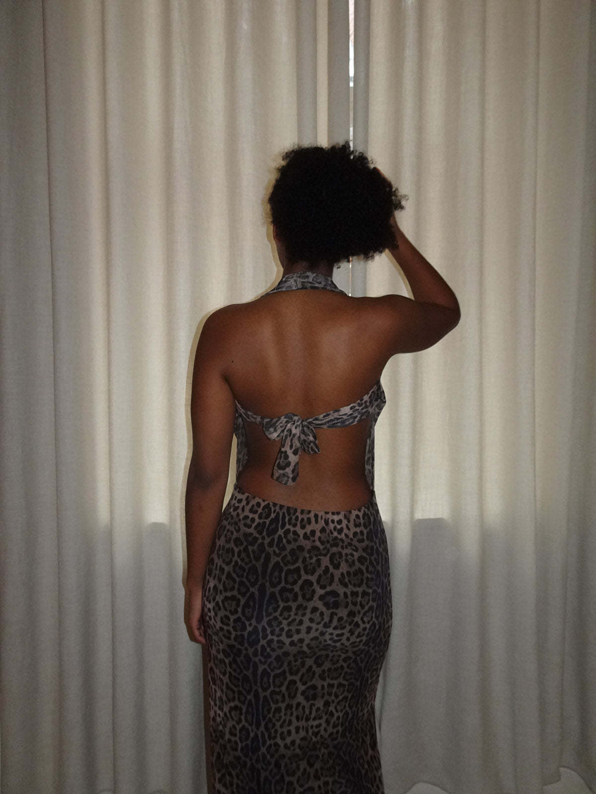 Tan leopard maxi dress with plunging V-neck and backless design