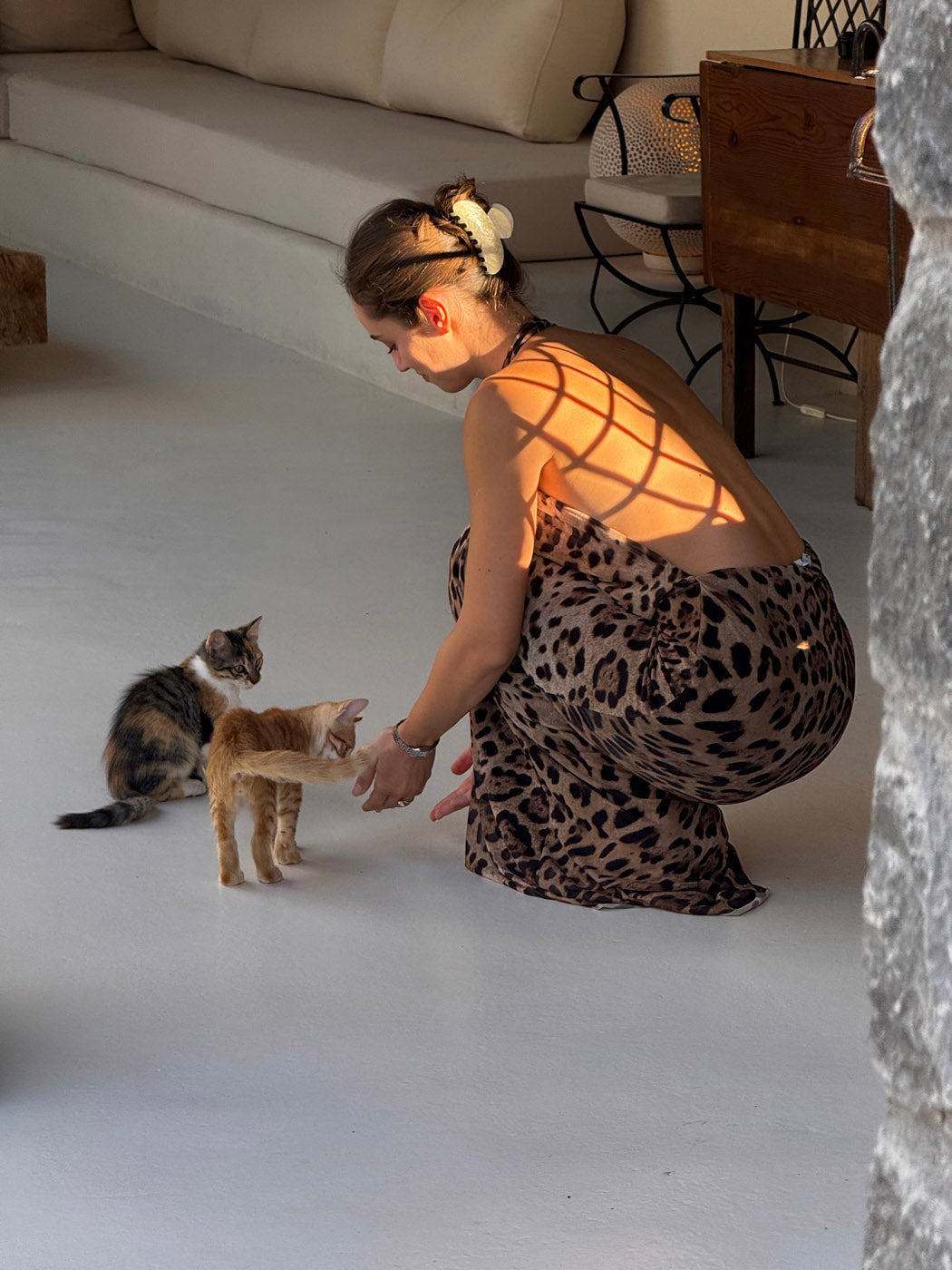 Backless leopard maxi dress showing open back design and fitted silhouette