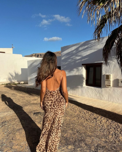 Leopard print backless maxi dress full length back view in natural light
