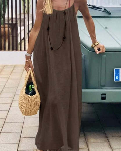 Taupe backless maxi dress with spaghetti straps and flowing hem