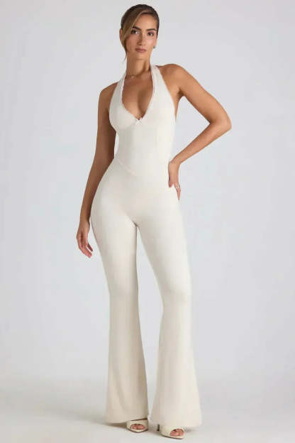 Cream halter backless jumpsuit with V-neck and wide-leg silhouette front view