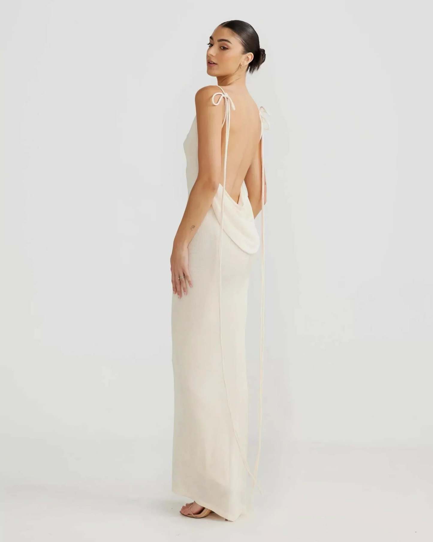 Cream backless cowl maxi dress with floor-length hem and draped back for women