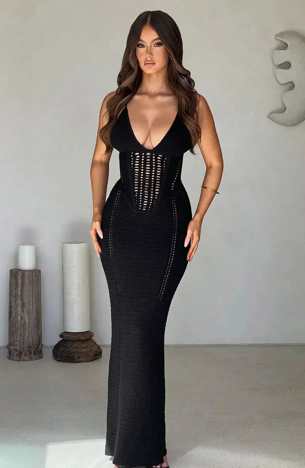 Black cutout maxi dress with v-neckline and lattice waist details